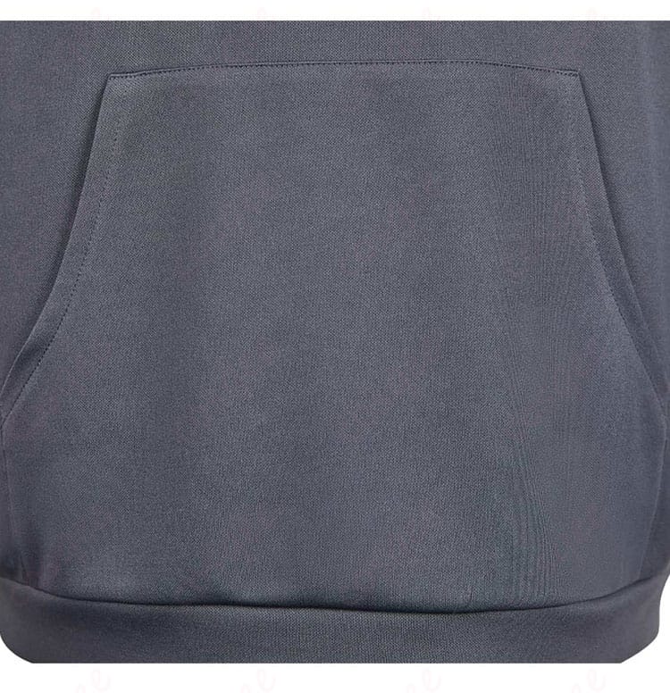 怪獣パーカーの衣袋の装飾。便利なポケットデザインと詳細な仕上げ。